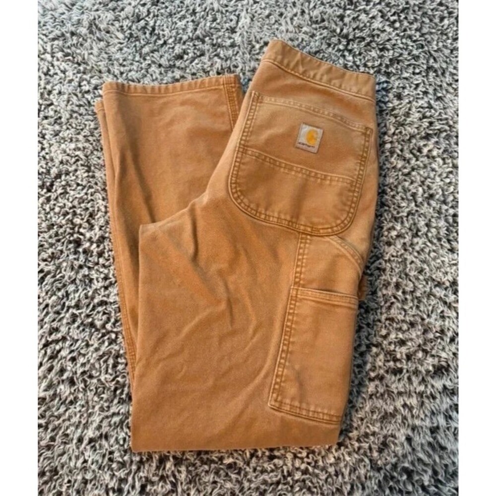 Carhartt canvas carpenter or work pants featuring a utility pocket 30/32
